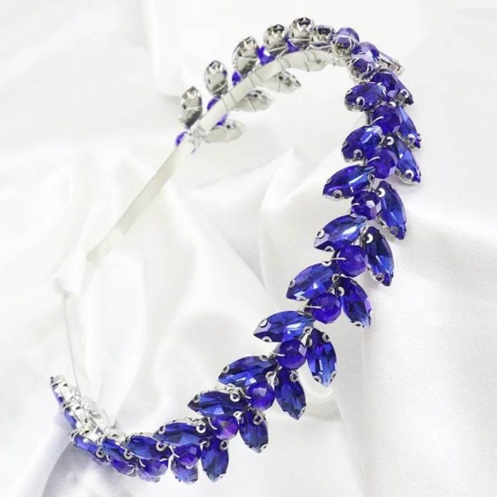 a vintage vine style headband with royal blue crystals for the races from the divalicious candyland collection