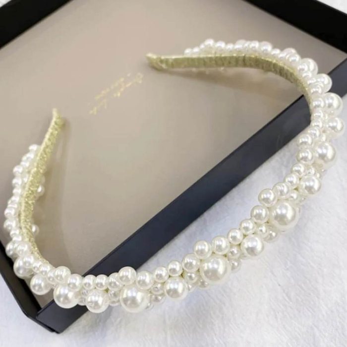 a classic pearl headpiece for the races or wedding